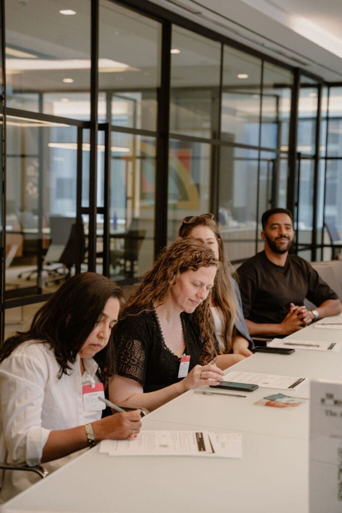 Women founders actively working through exit readiness exercises at Build to Exit NY Tech Week 2026